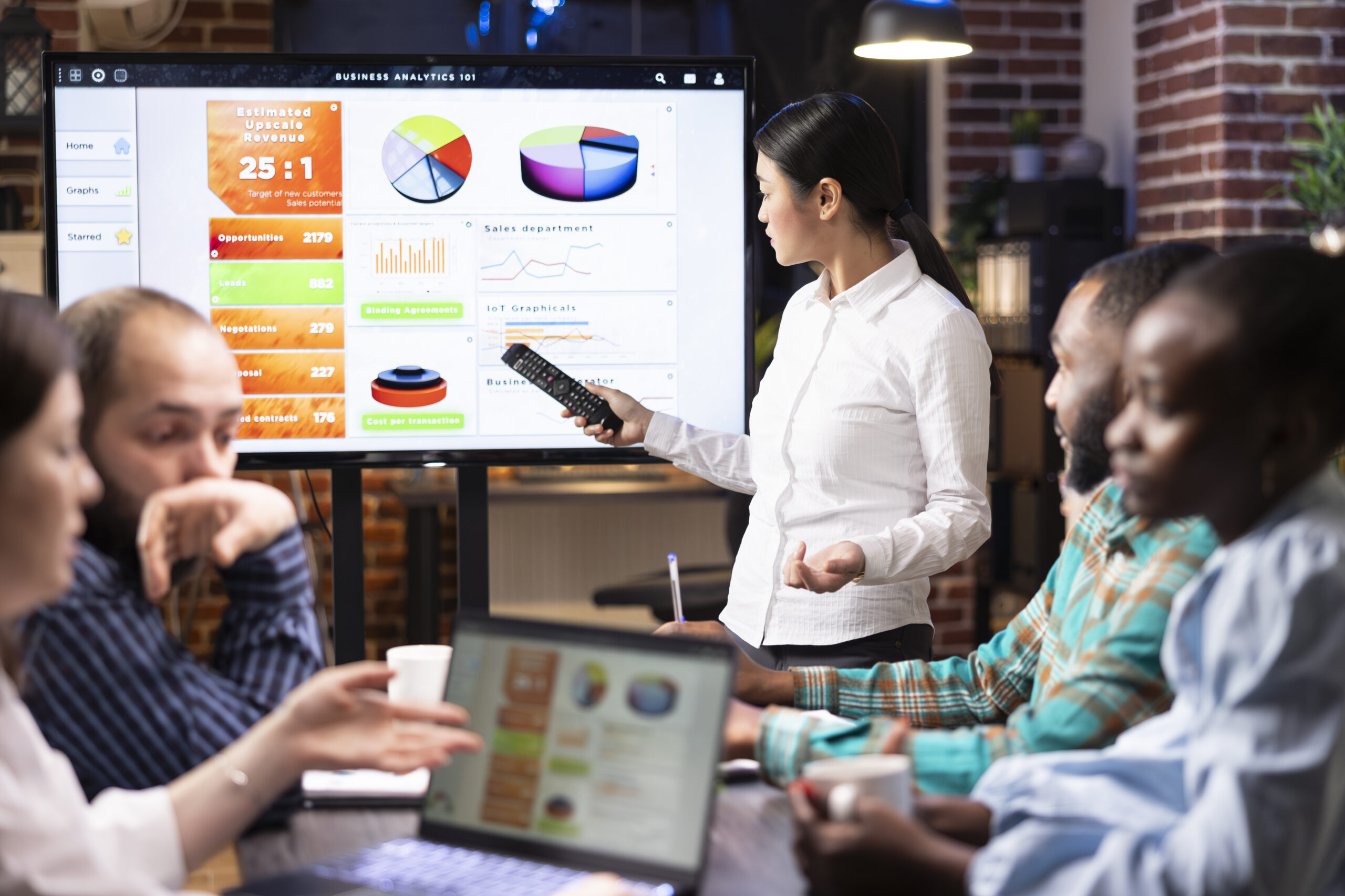 CASE STUDY: Modernizing Customer Data & Marketing Activation for a Global Life Sciences Leader 2 asian manager discussing business analytics with team scaled