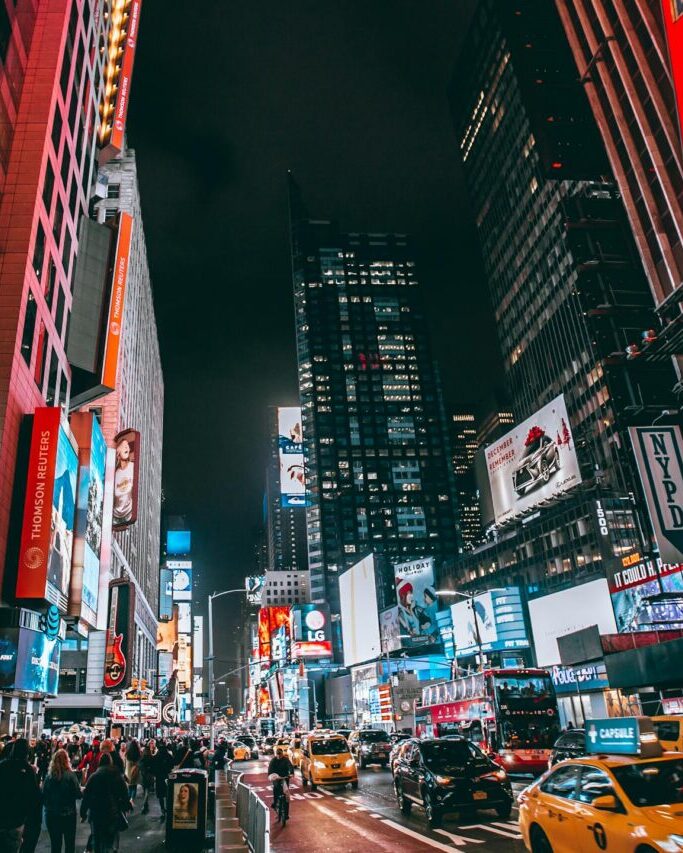 bustling evening scene in new york citys iconic times square showcasing bright lights and lively atmosphere. 1737957 scaled e1734102560272