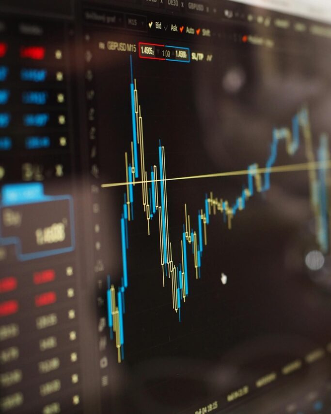 detailed view of financial trading graphs on a monitor illustrating stock market trends. 159888 scaled e1734103137919