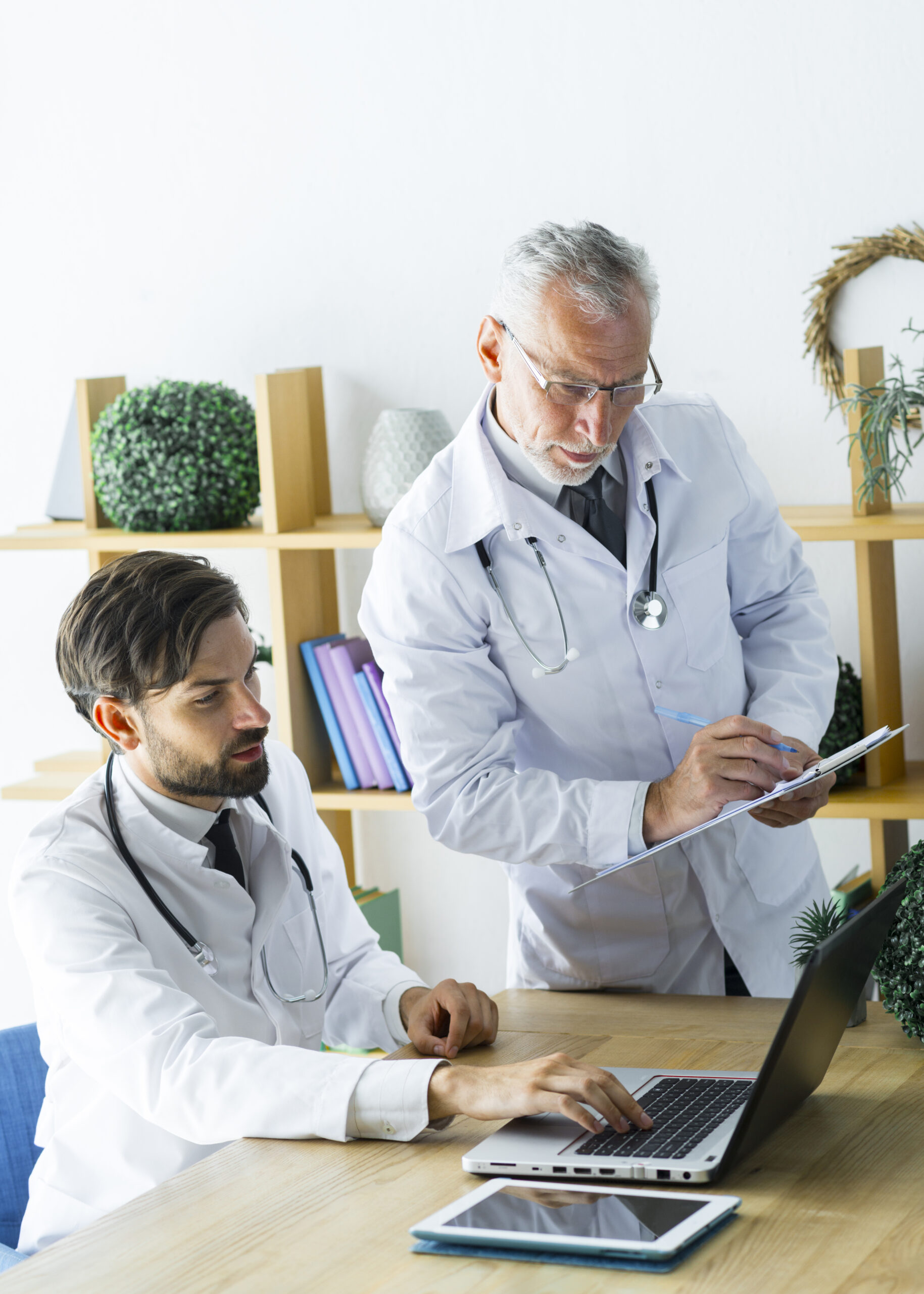 CASE STUDY - landing page 8 young doctor showing data senior colleague scaled